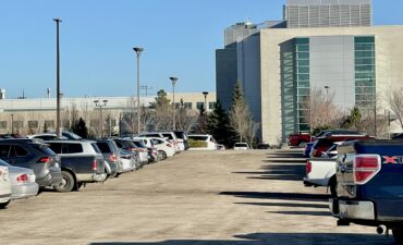 Lot 1, south-west of campus. M-pass holders park in rows.