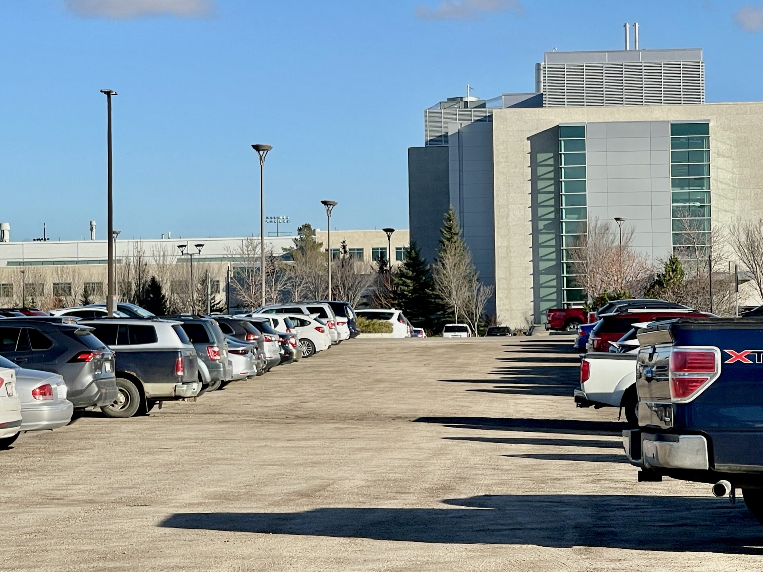 Lot 1, south-west of campus. M-pass holders park in rows.